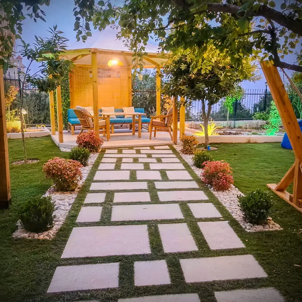 Stone path across the lawn at dusk